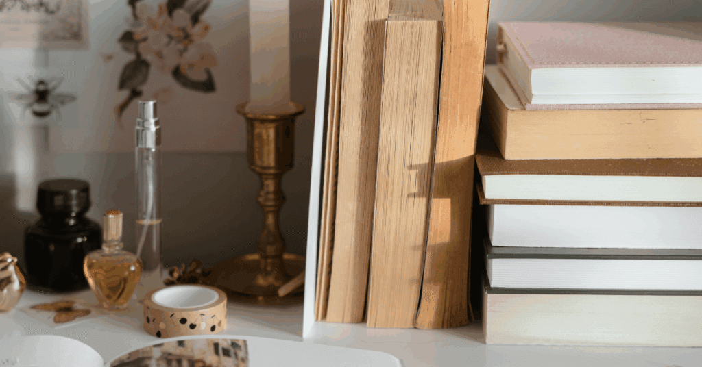 Books and a candle on a rustic workspace